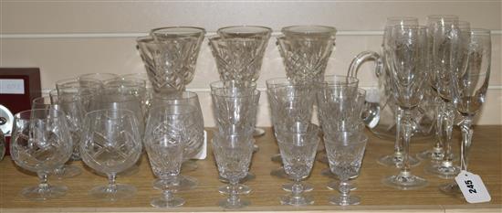 A quantity of cut, panelled and engraved table glass, part suites